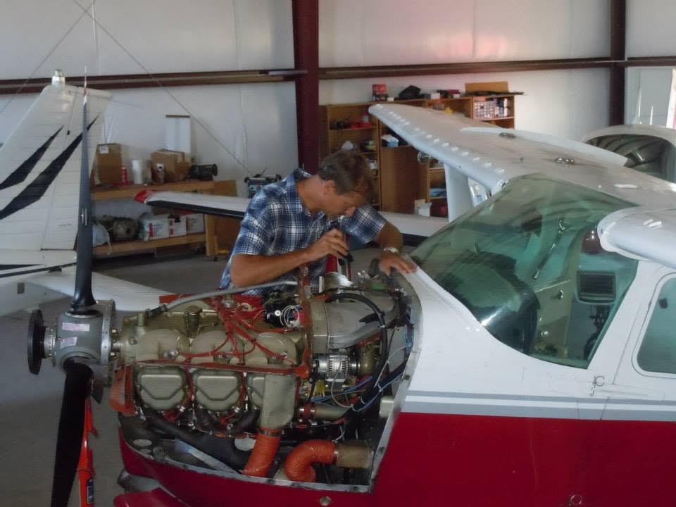 Erik working on a Cessna engine in the hangar